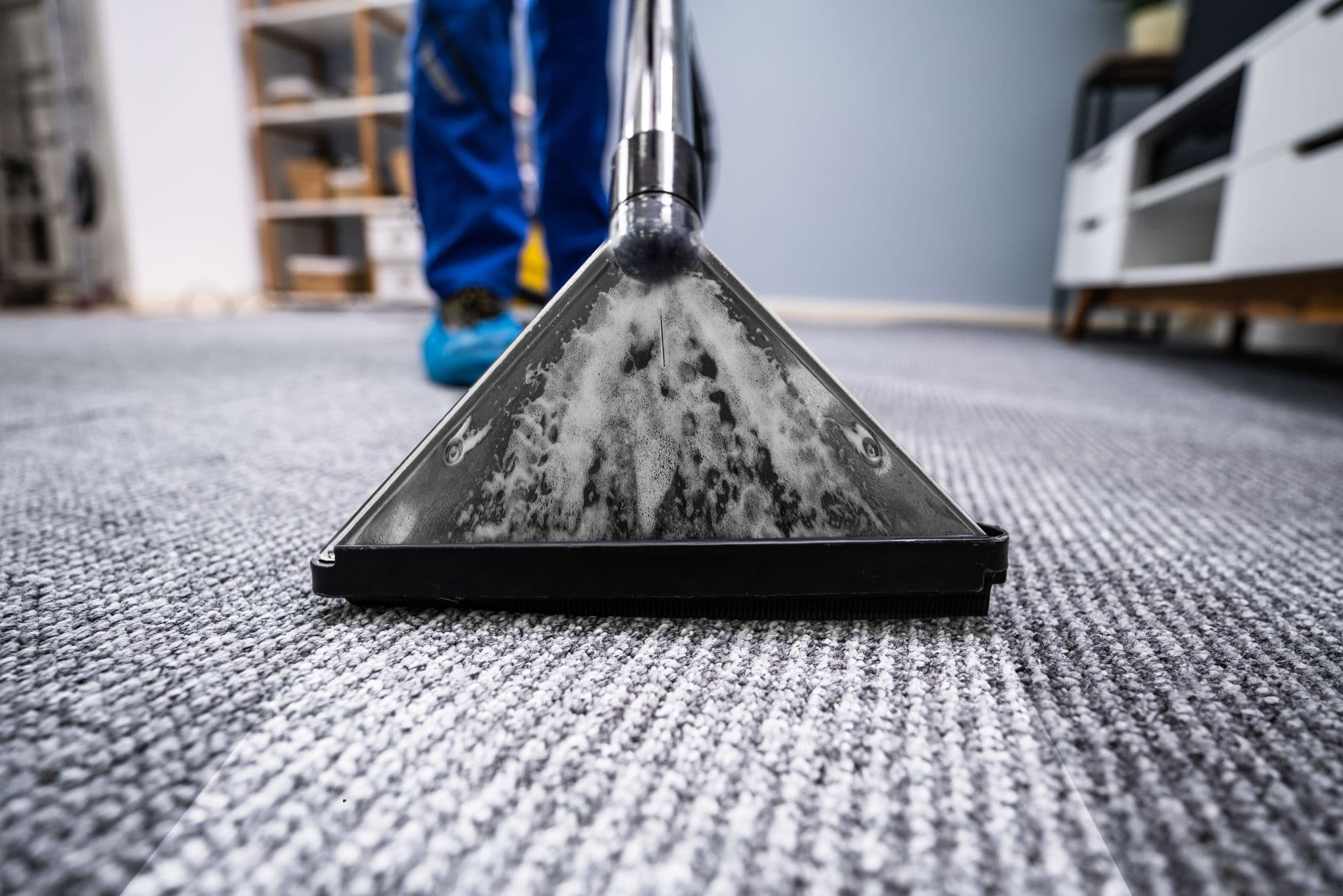 Commercial cleaner at work in a business premises
